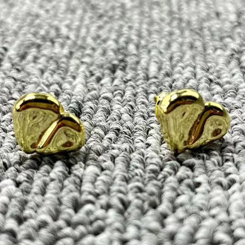 

Новинка 2022 г., изысканные модные гальванизированные серьги unode 50 925 14K серебристый неправильной формы в форме сердца, ювелирные изделия в под...