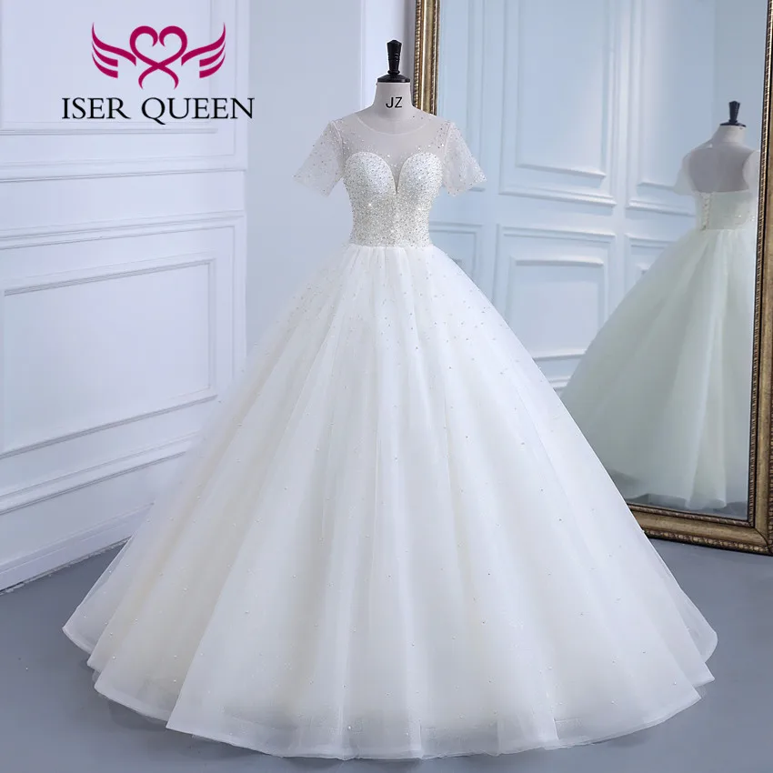 

Sheer Neck Short Sleeves Europe 2023 New Wedding Dress Crystal And Pearls Beaded Bright Gilter Tulle Bride Wedding Gown WX0309