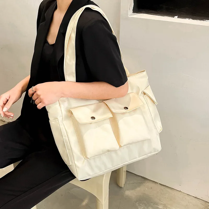 

Large Capacity Canvas Women's Bag 2023 New Simple Commuting One Shoulder Tote Bag Fashion Double Pocket Portable Underarm Bag