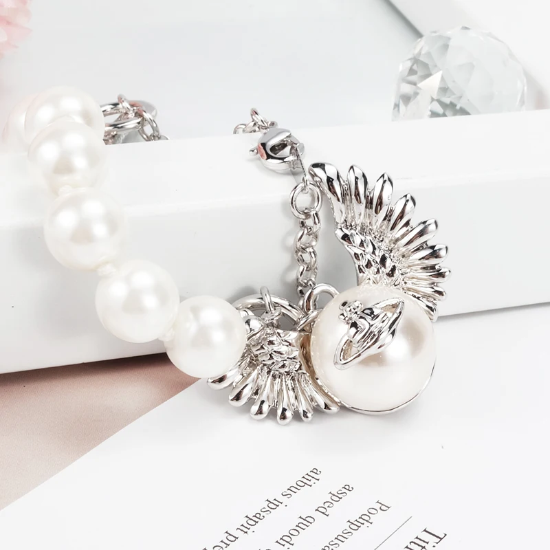 

Pop Vivienne West Queen Pearl Wings Dragon Claw Saturn Bracelet For Fashion Women Jewelry Punk Style Ins Same Style Couple Gift