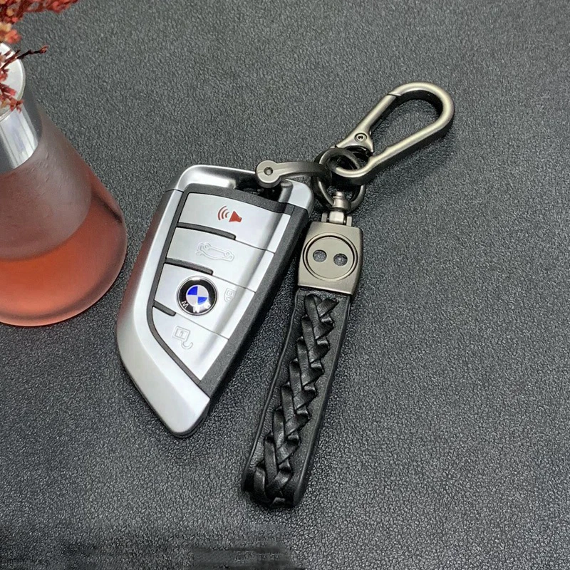 

Handwoven Sheepskin Car Keychain Metal Creative Car Logo Versatile Zinc Alloy Keychain Leather Rope Pendant