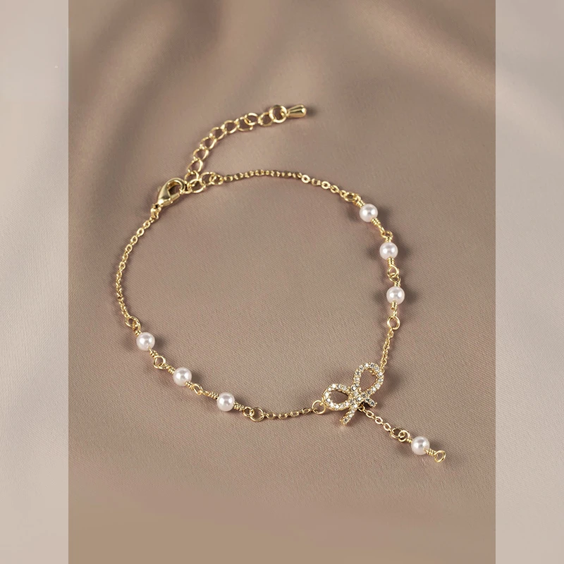 

Flower trace bow bracelet women's sweet and simple all-match Mori niche design pearl bracelet