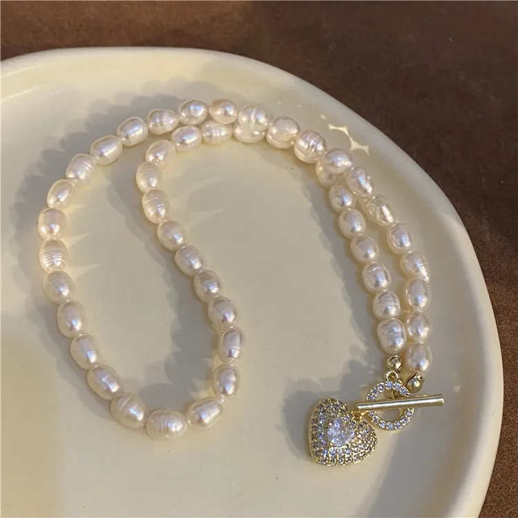 

Ожерелье с пресноводным жемчугом для женщин, роскошная цепочка с подвеской в виде банта и сердца, дизайнерские ожерелья