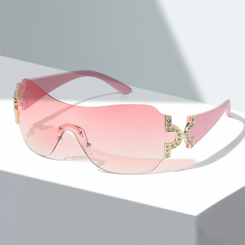 

Солнцезащитные очки без оправы для мужчин и женщин, оверсайз со стразами, модные трендовые розовые винтажные солнечные очки для вождения в ...