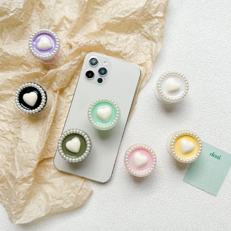 

1pcs.Mobile phone holder small fresh solid color love pearl ring paste type ring Grip Tok Folding Finger Stand Socket