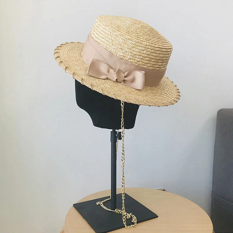 

2022 luxury designer brand spring and summer flat top straw straw hat bow decoration metal hanging chain beach hat adjustable