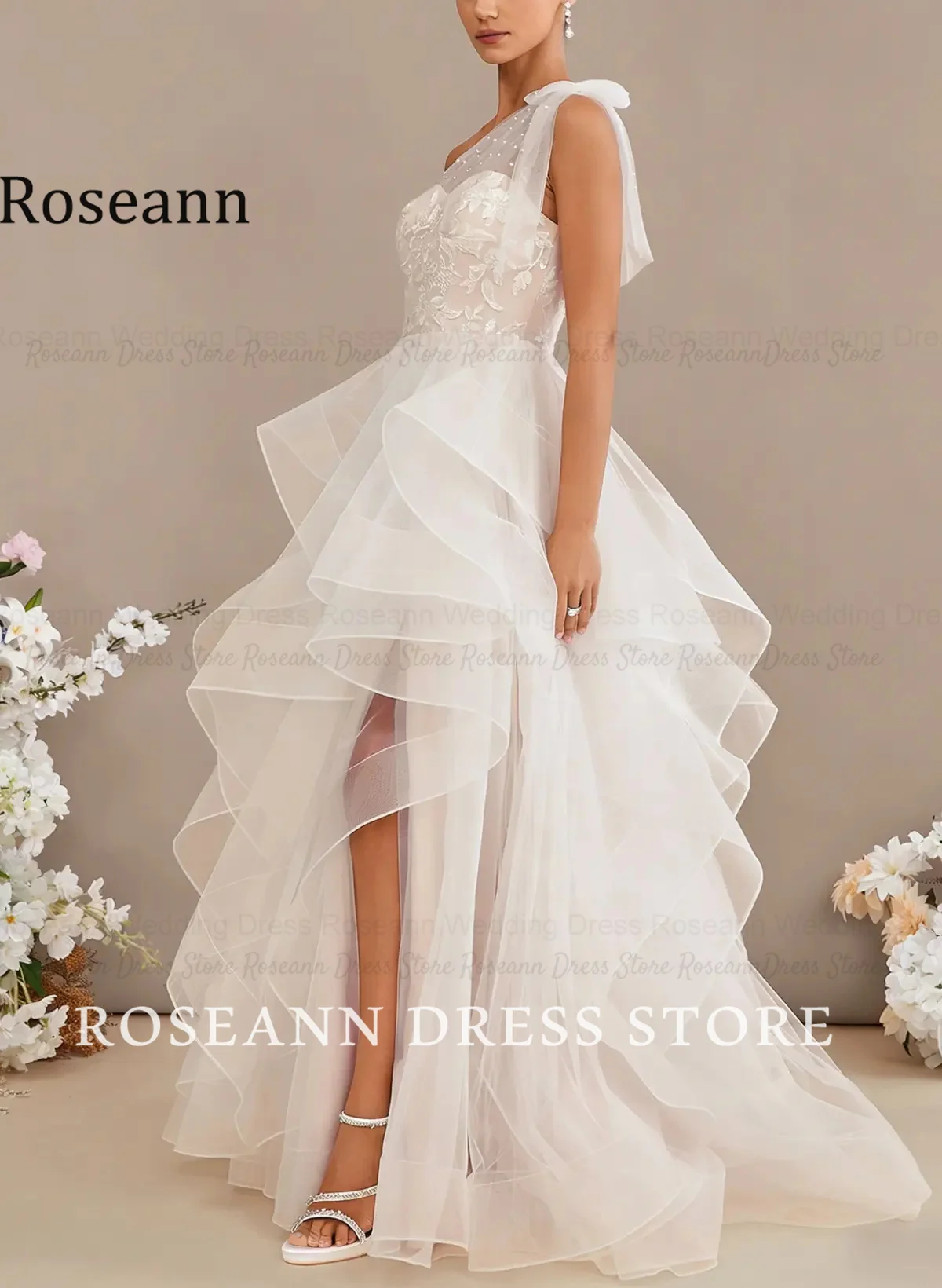 Фото Свадебное платье Roseann с бантом, на одно плечо, кружевное, с эффектом иллюзии, многоярусное, с рюшами из тюля, А-силуэт, с шлейфом, свадебное платье на заказ. №3