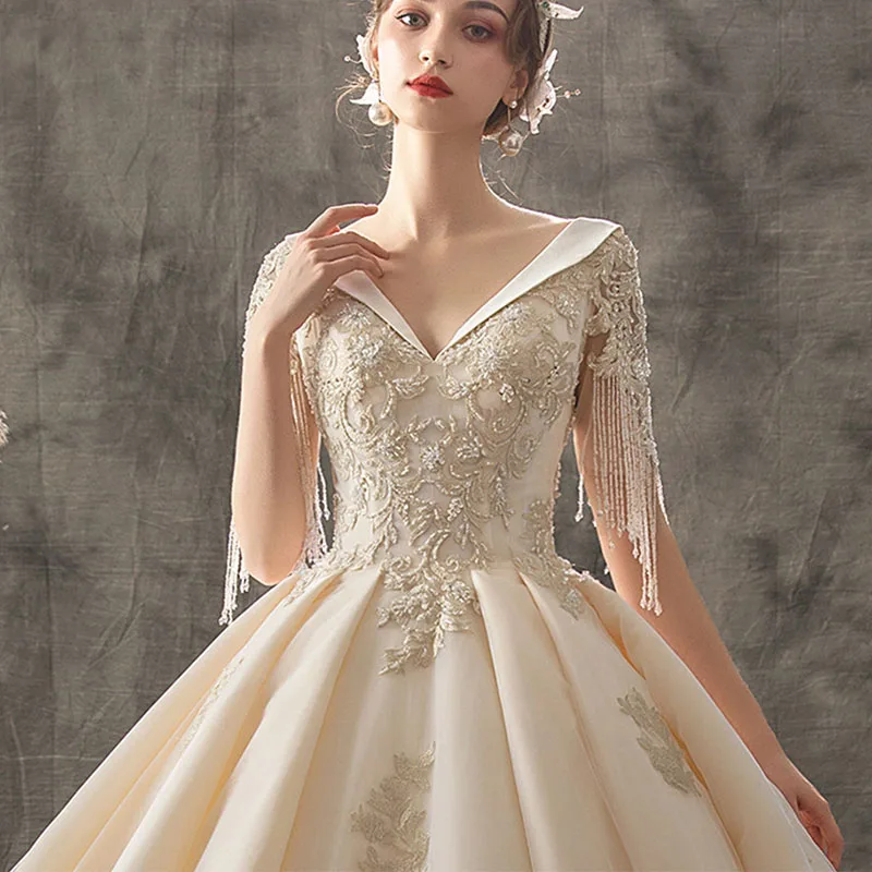 

Luxurious Wedding Dress Short Tassel Sleeves V-Neck Beading Bridal Ball Gown Sparkle Applique With Train Robe De Mariée