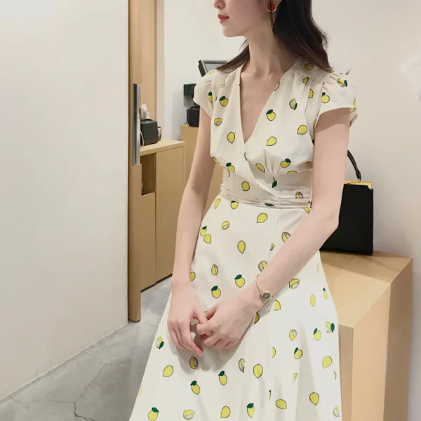 Australian blogger's same lemon print bubble short sleeved low neck 2022 new women's summer mid length dress