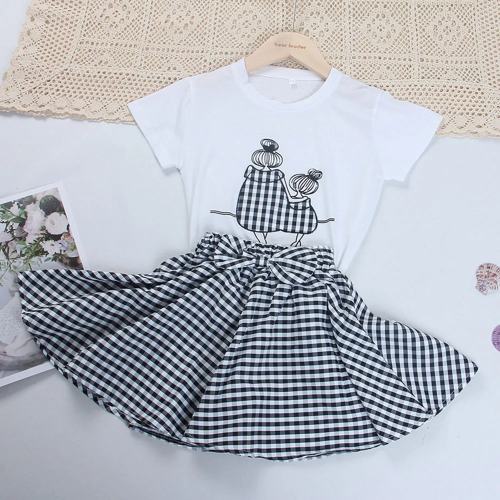 

Kids Girl Casual Summer Clothing Children's Fashion White Tees And Plaid Shorts Clothes Teens Cartoon Print Cute Bow Suits 4-13Y