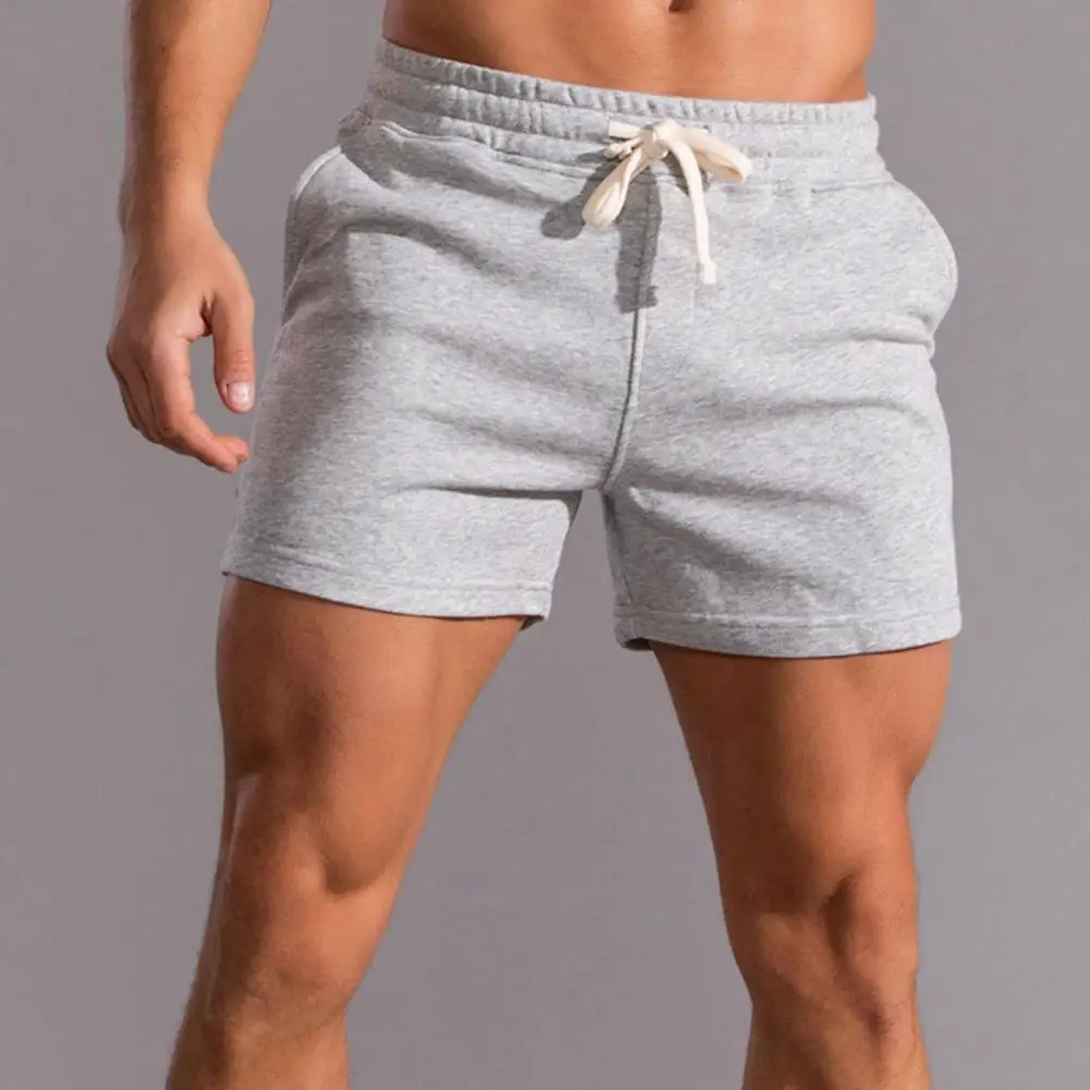 

Men Solid Color Shorts Soft Breathable Men's Sports Shorts with Drawstring Elastic Waist Sweat Absorption Pockets for Jogging