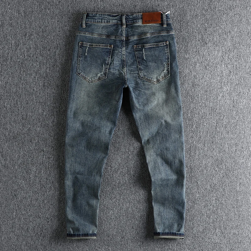 High street retro ins trend to make old ripped patch jeans men's slim feet baggy autumn trousers