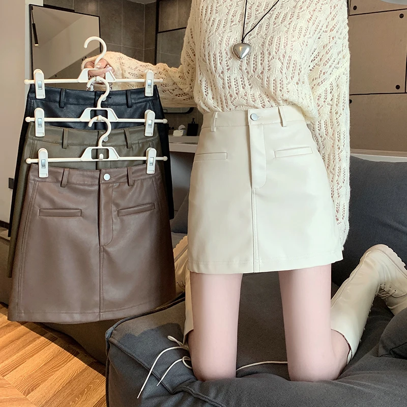 

Real Autumn New Korean Version High Waist Slim and Versatile Wrapped Hip Short Skirt with Small Audience Solid Color Design Sens