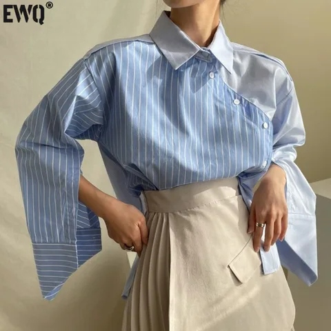 [EWQ] 2023 Spring autumn Women Casual Blouse Asymmetrical Single Breasted Turn-down Collar Long-sleeved Panelled Striped Shirt
