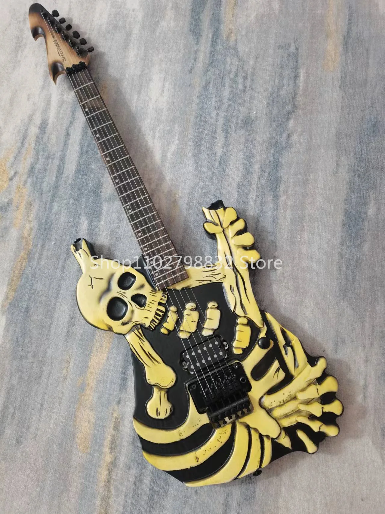 

6-string skull electric guitar, rose fingerboard, black accessories, tremolo system, free shipping