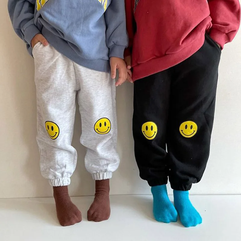 

Детские спортивные штаны 1035B, с принтом улыбающегося лица, хлопковые Свободные Штаны для мальчиков и девочек 10 лет, корейский стиль, 2022