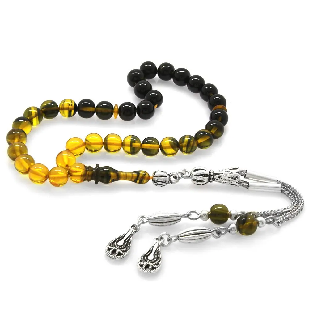 

Nipora Tarnish Metal Tasseled Globe Cut Wrist Length Strained Yellow-Black Fire Amber Rosary