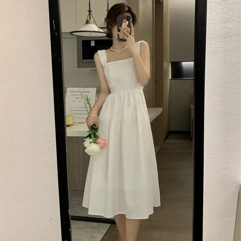 

Seaside holiday strap skirt female spring summer 2023 new tea break French white dress temperament long dress
