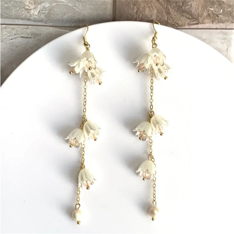 

Aromantic Pride Shimmer Lily of the Valley Cute White Flower Dangle Earrings for Women Nature Inspired, Fairy Bell Earrings Lily