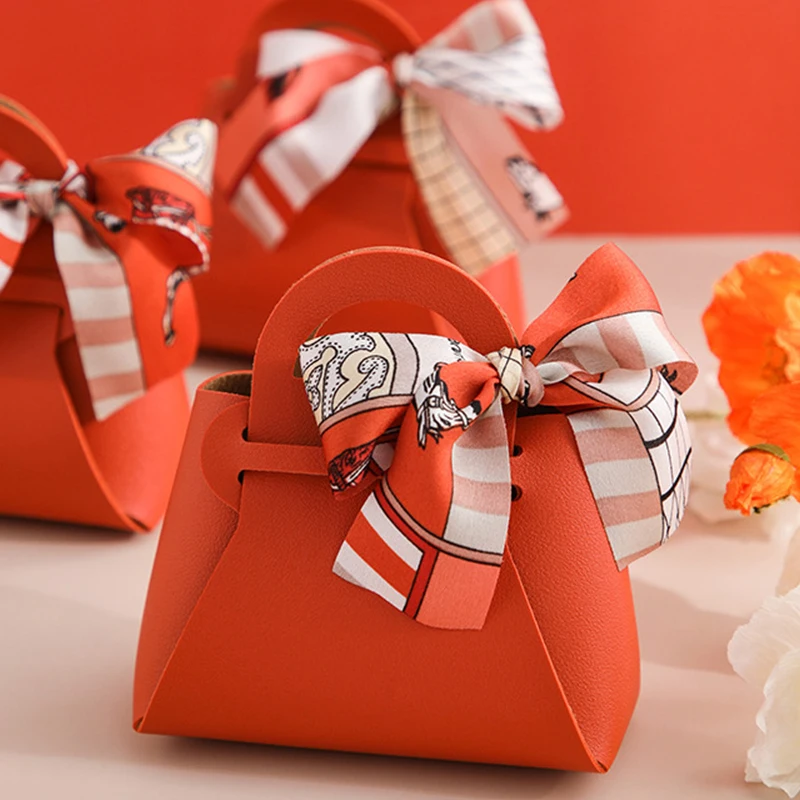 

Small PU Leather Gift Box Creative Handbag Shaped Ribbon Bow Temperament Wedding Party Favors Candy Box With Hand