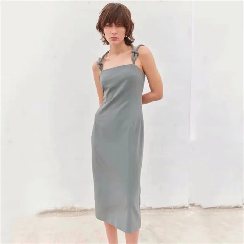 

2022 summer niche Nordic style bow element suspender dress, temperament commuter high waist simple casual midi skirt women