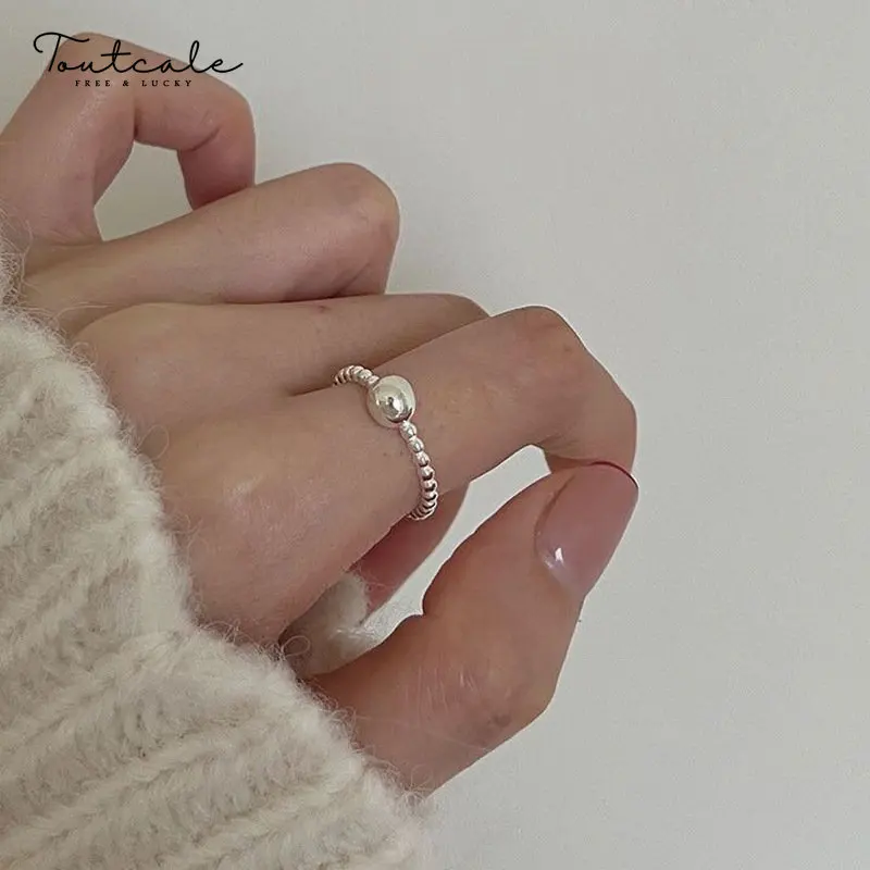

Toutcale S925 Sterling Silver Beaded Bean Ring Female Minimalist Cold Wind Niche Design Solid Ball Food Ring