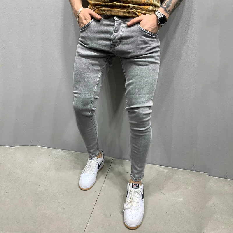 Europe and the United States new wish men's pants ripped white loose denim trousers fashion pencil pants Stylish casual jeans