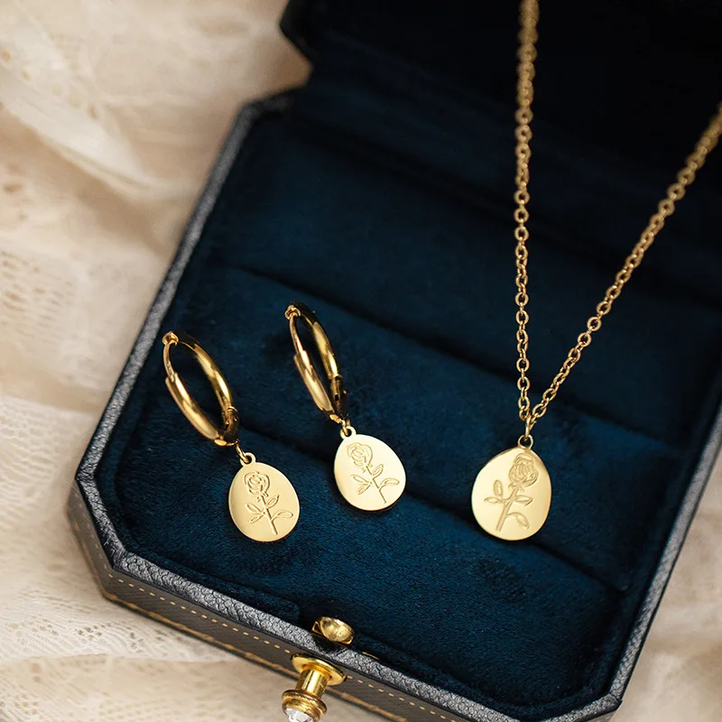 

CARLIDANA 2pcs/Set 18 K Stainless Steel Rose Flower Pendant Necklace/Hoop Earrings Vintage Gold Plated Jewelry Set for Women