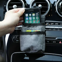 car air vent storage bag car mobile phone charging treasure documents and other storage bag with data cable hole car hanging bag