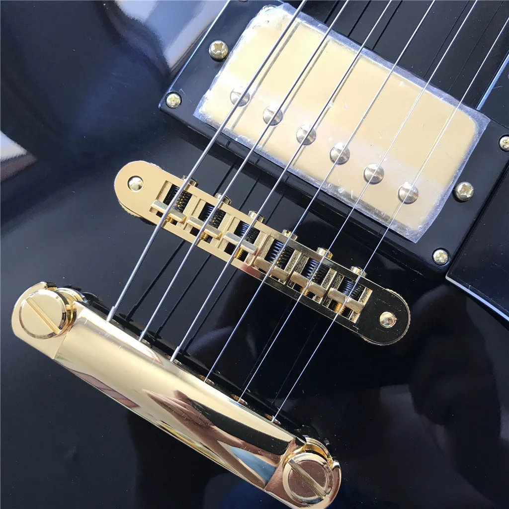 Новое поступление электрическая гитара с черным грифом и золотистым корпусом