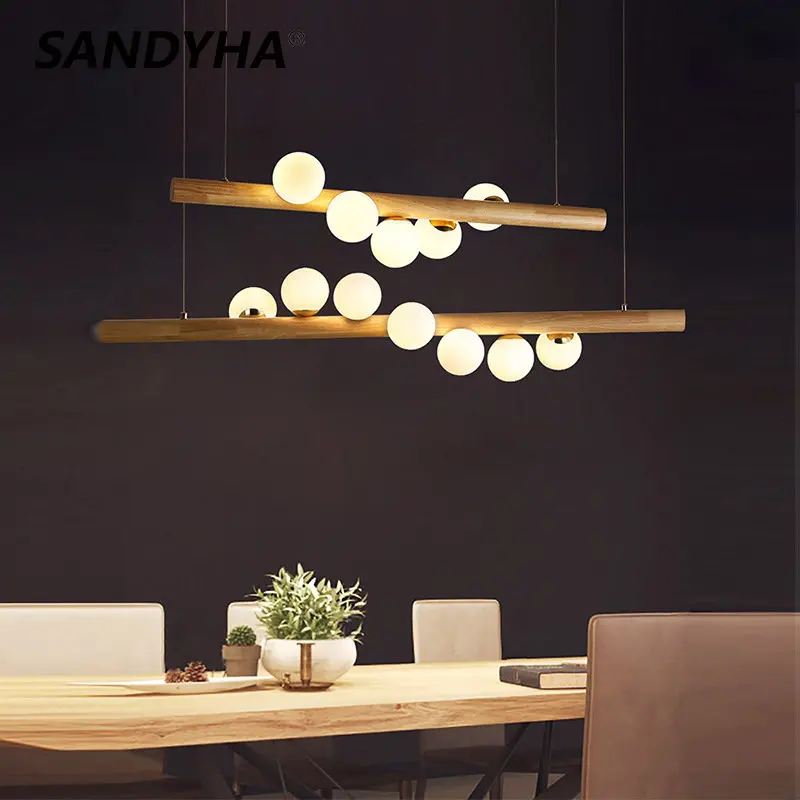 Купи Modern Nordic Minimalist Solid Wood Lamp Round Magic Bean Glass Iron Restaurant Cafe Bar Office LED Energy-saving Pendant Lights за 5,460 рублей в магазине AliExpress