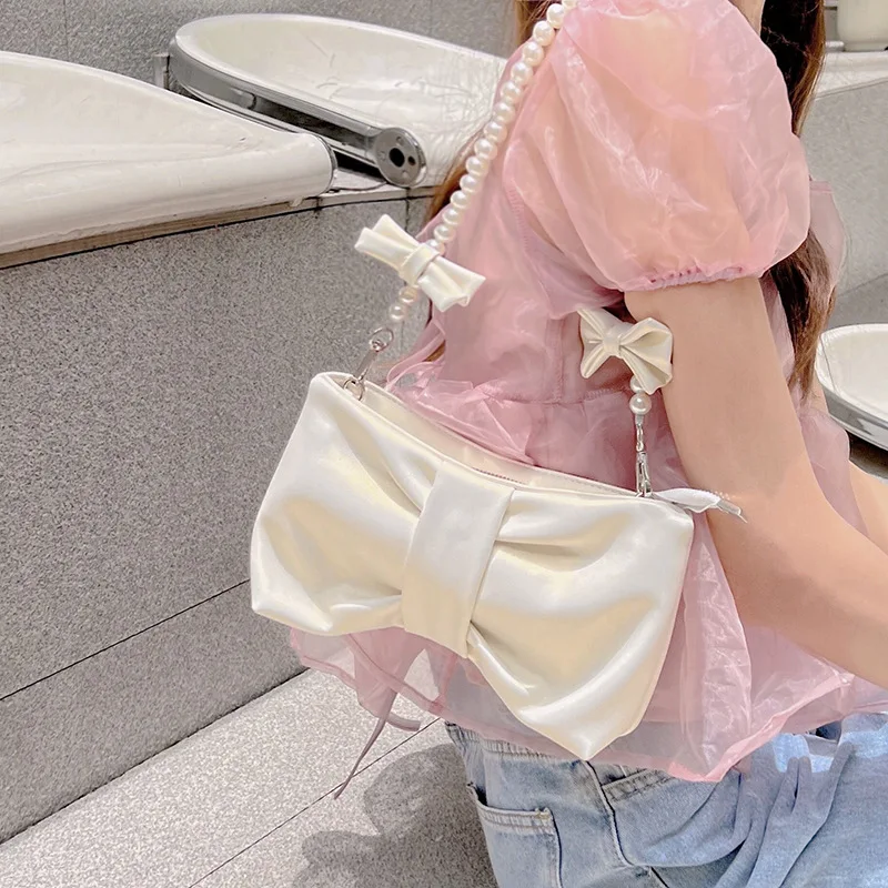 

2023 Pearl Bowknot Underarm Bag for Women Pink White Pearlescent Shoulder Bag Ins Designer Gentle Handbag Crossbody Storage Bags