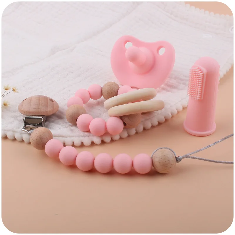 

4Pcs/Set Baby Pacifier Clips Silicone Pacifier Finger Toothbrush for Babies Beech Wood Ring Teether Chewing Toy Infant Baby Gift