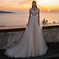 beach wedding dress sweep train sheer bateau long sleeves illusion bridal dresses pearl applique buttons sexy beach wedding gown