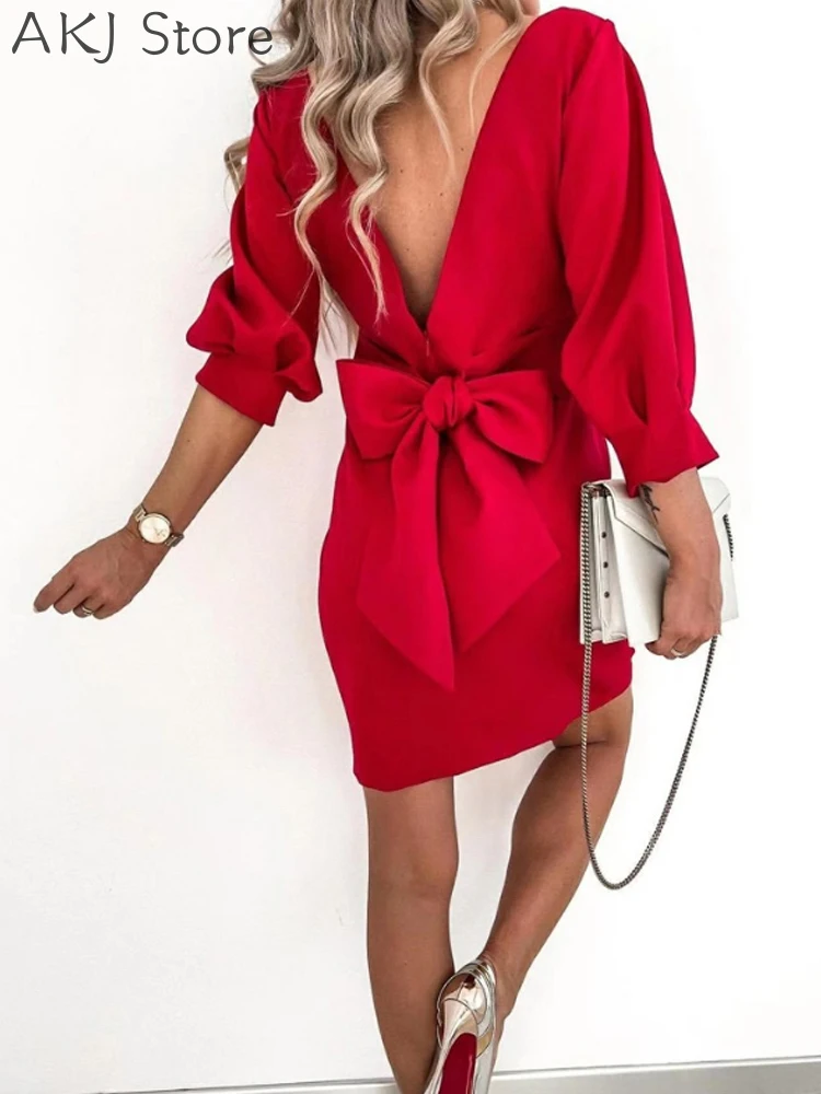 

Женское мини-платье с бантом на три четверти