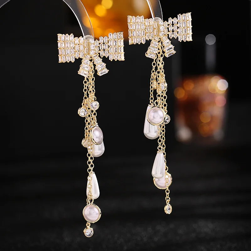 

French temperament light luxury fashion long bow zircon pearl tassel earrings s925 silver needle LYX149
