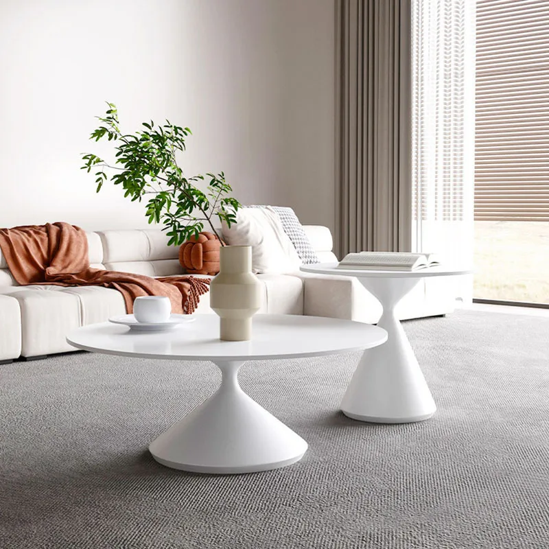 

Creative designer for the Italian minimalist large flat living room with a combination of circular tea tables in the size of the