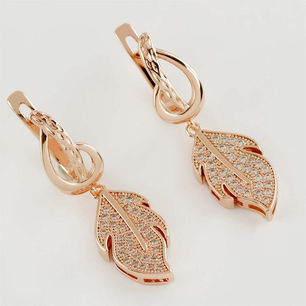 

Роскошные фигурные серьги из циркония и стали с листьями