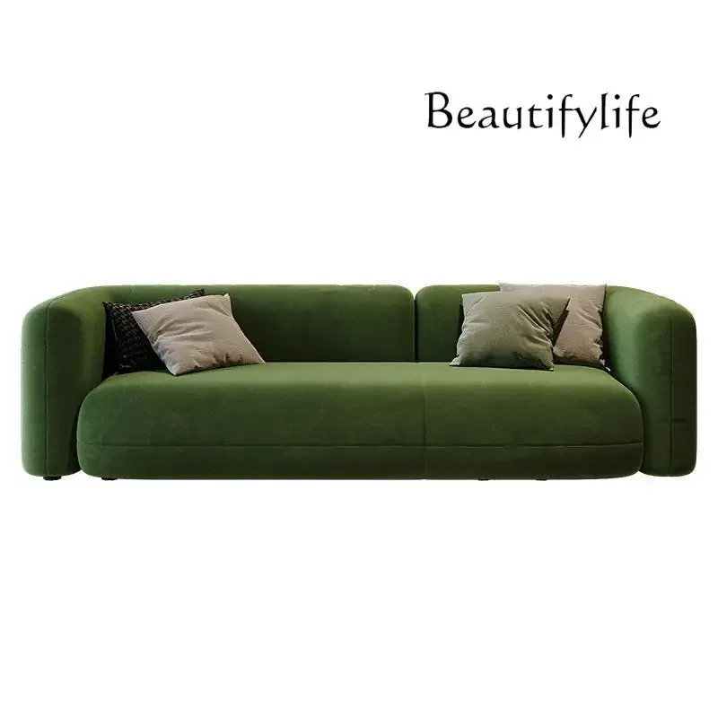 Магазин одежды квартира гостиная темно-зеленый тканевый диван современный