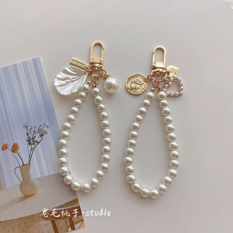 

Vintage Gold Coin Pearl Chain Women's Ins Style Gold Pendant Mobile Phone Lanyard Short Wrist Strap Pearl Pendant Phone Lanyard