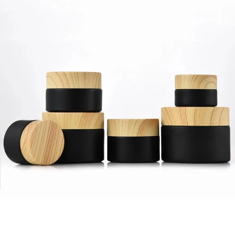 

100p Black Frosted Glass Jars Cosmetic Jars With Woodgrain Plastic lids PP liner 5g 10g 15g 20g 30 50g lip Balm Cream Containers