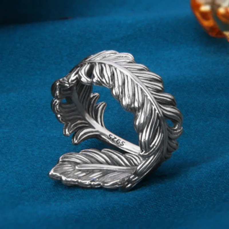 Мужское и женское кольцо из серебра 925 пробы с перьями