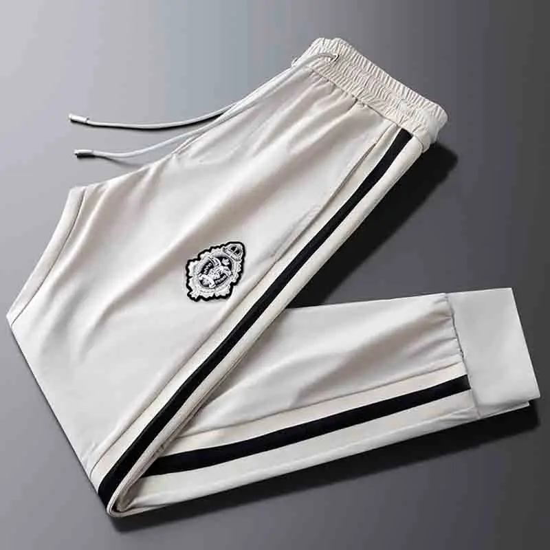 Light luxury and good quality khaki ice silk quick-drying sports pants men's self-cultivation strap feet tide brand embroidered
