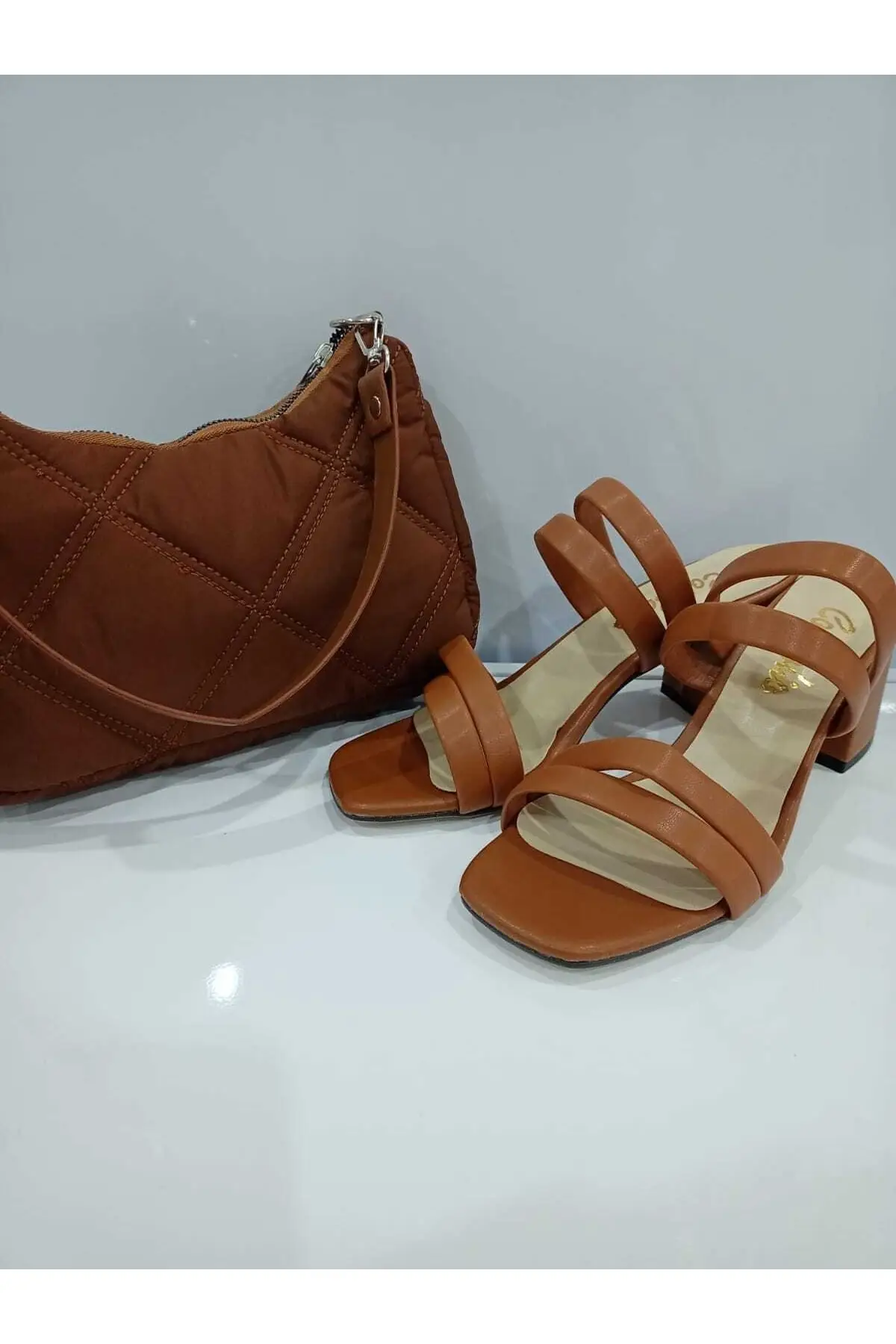 

Brown heels slippers