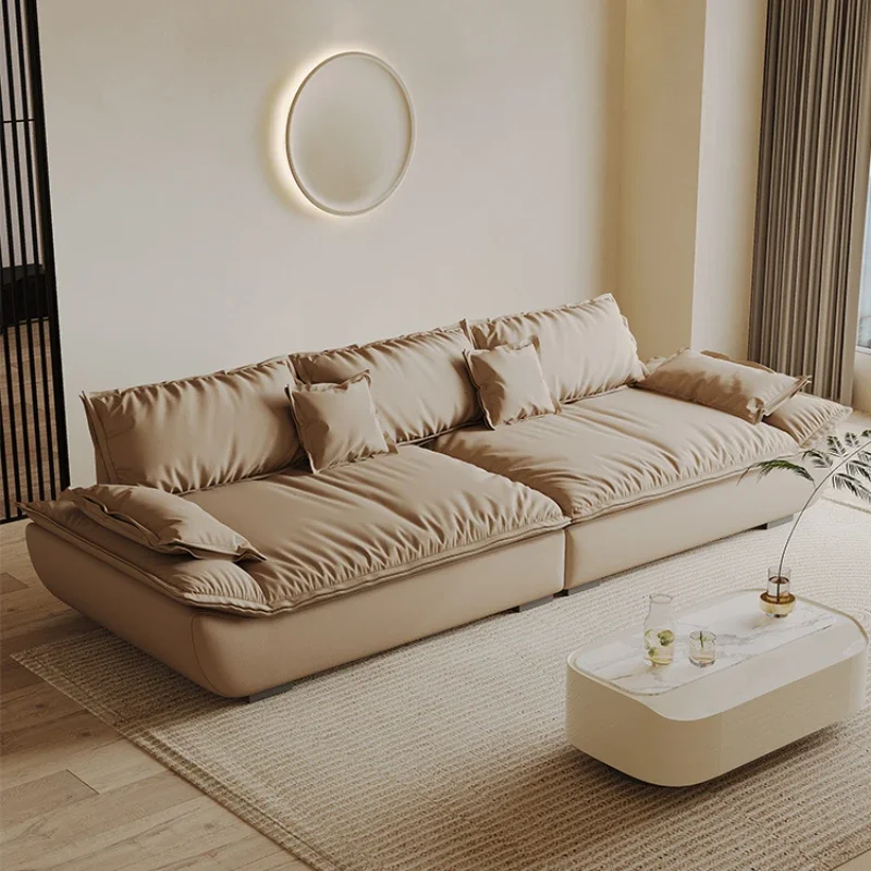 

Light luxury inline leather sofa living room size three-seater minimalist wabi-sabi cream sailing sofa combination