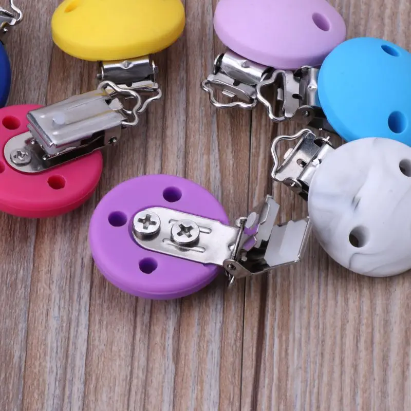 

Силиконовые зажимы для прорезывания зубов