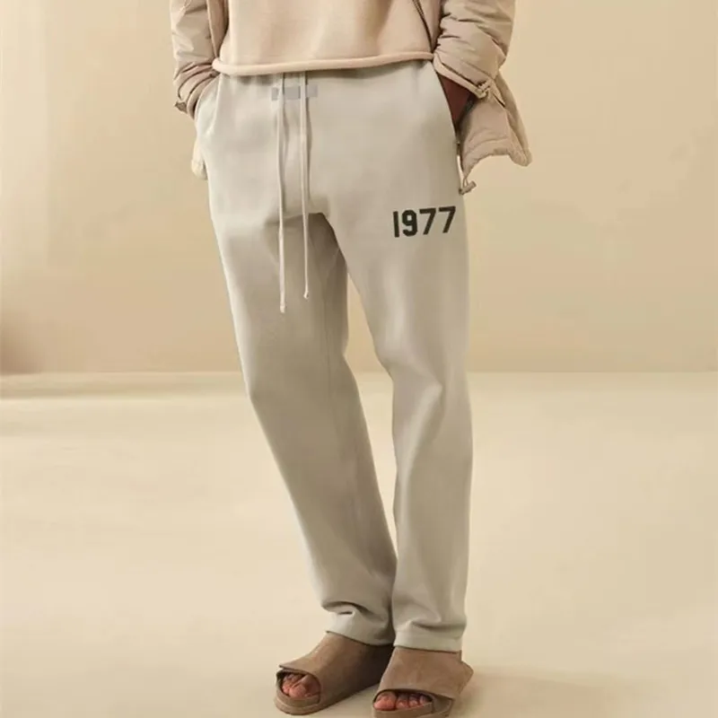 

Ess 1977 Sweatpants Flocking Printing Pants Casual Loose Sweatpants Men and Women High Quality 1:1 Spring Autumn Thermal Pants