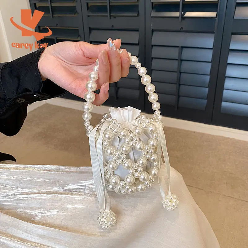 

Сумка CAREY KAY женская с жемчугом, миниатюрный саквояж на шнурке, сумочка на плечо, мессенджер с жемчужной цепочкой