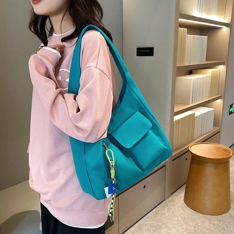 

2023 New Canvas Bag Women's Versatile Student Commuter Schoolbag Large Capacity Versatile Shoulder Bag Girl