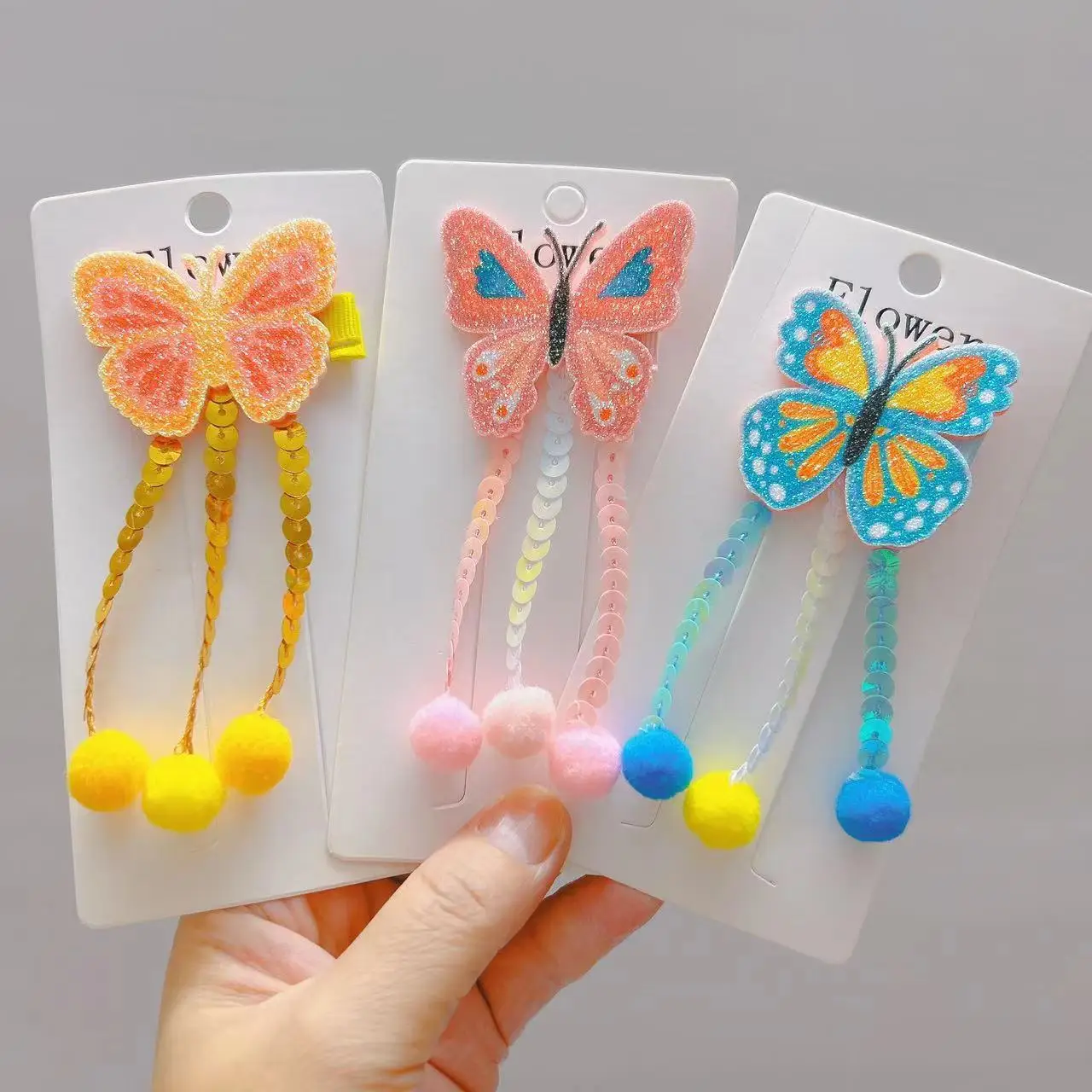 

2pcs/lot Glitter Butterfly Hair Clips Sequins Tassels and Colorful Pom Poms Kid Party Hairpins Girls Grips Headwear Accessory